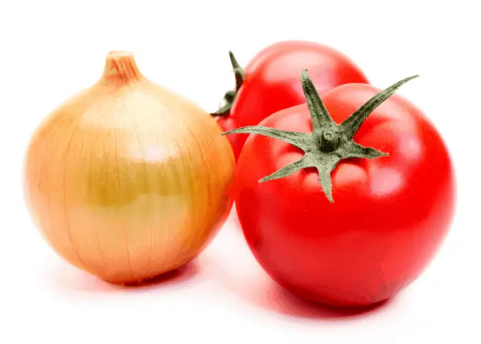 2 tomatoes and an onion on white background