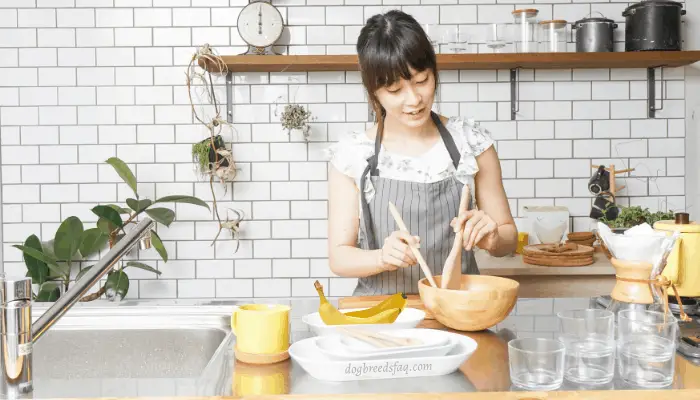 Asian girl cooking banana chips