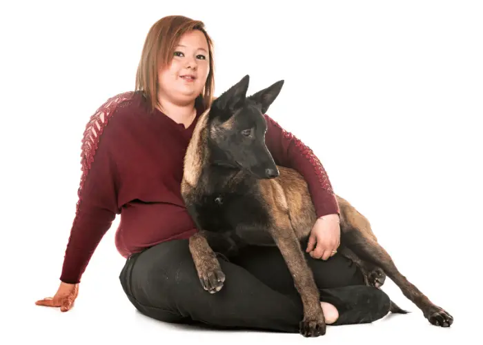 belgian malinois with its lady owner