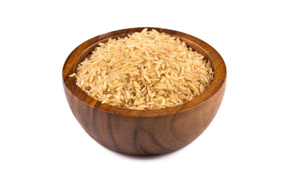 brown rice in a wooden bowl