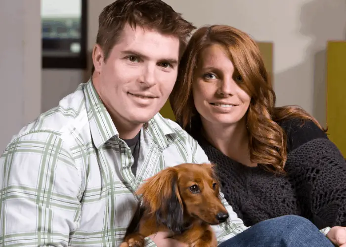 couple with their dachsund
