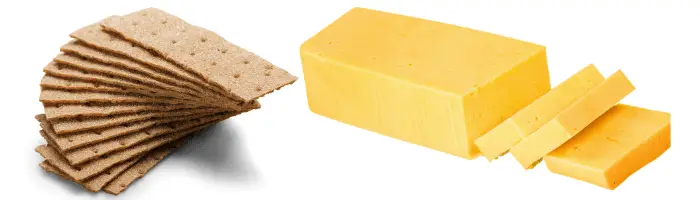 crackers and cheese on white background