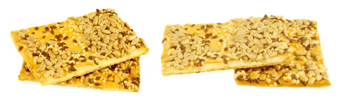crackers with sesame seeds on white background