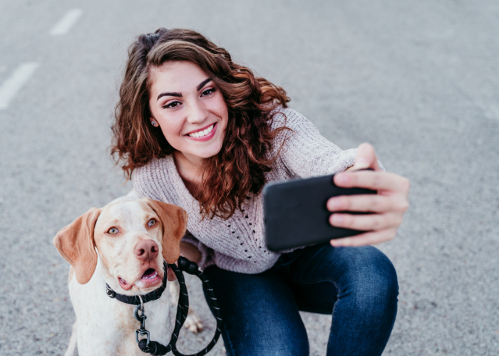 lady having a selfie with her dog