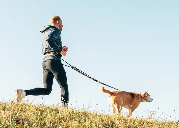 man running with his dog